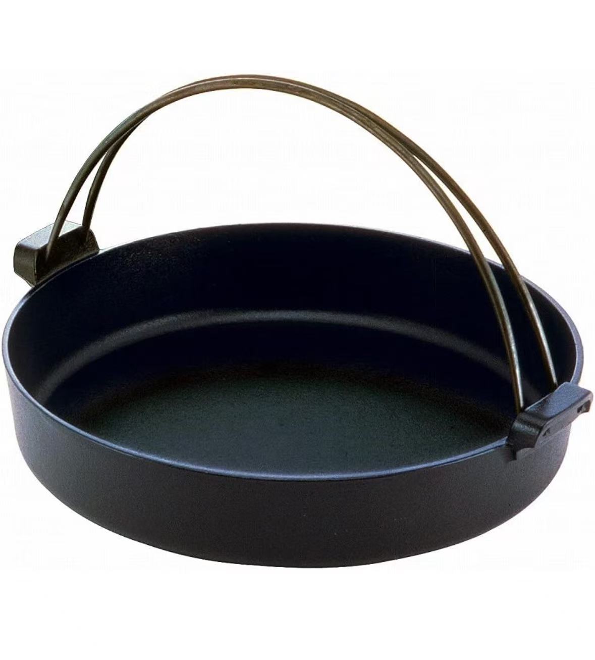 Japanese Cast Iron Sukiyaki Pan Iron Pot Shabu Shabu Nabe hotpot induction cookware, with a wooden insulate plate.
