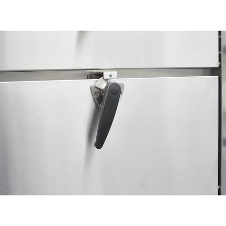Close-up of the insulated door and black latch handle on a Dukers DCSC36 steam cabinet